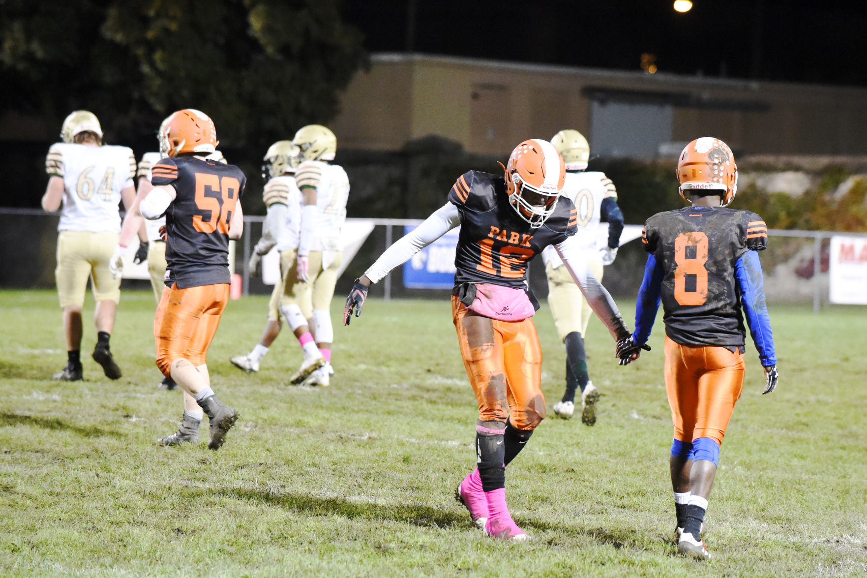 Park's Jayvian Farr (12) congratulates Ian Tremmel on well-played defense